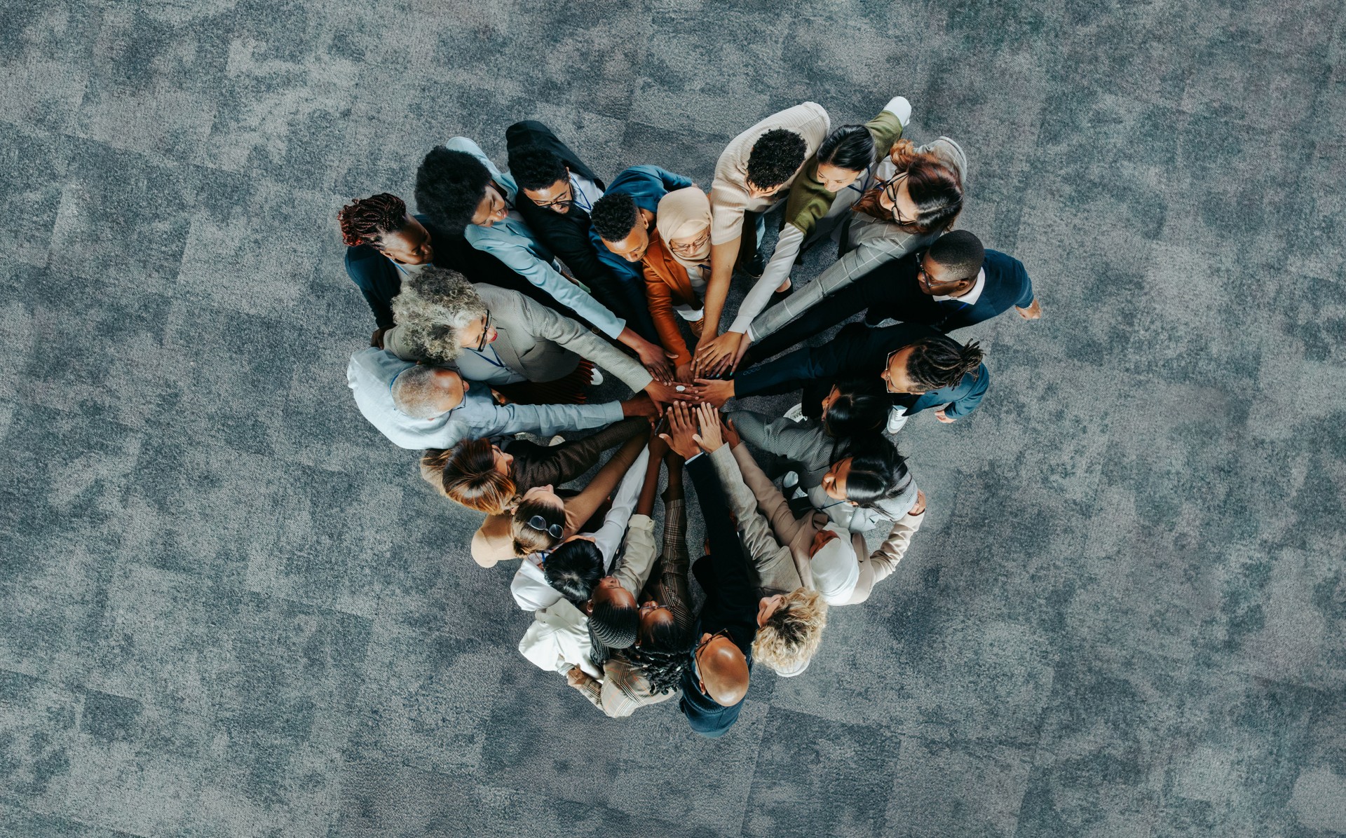 Top view of a a heart shape of people, showing unity and teamwork